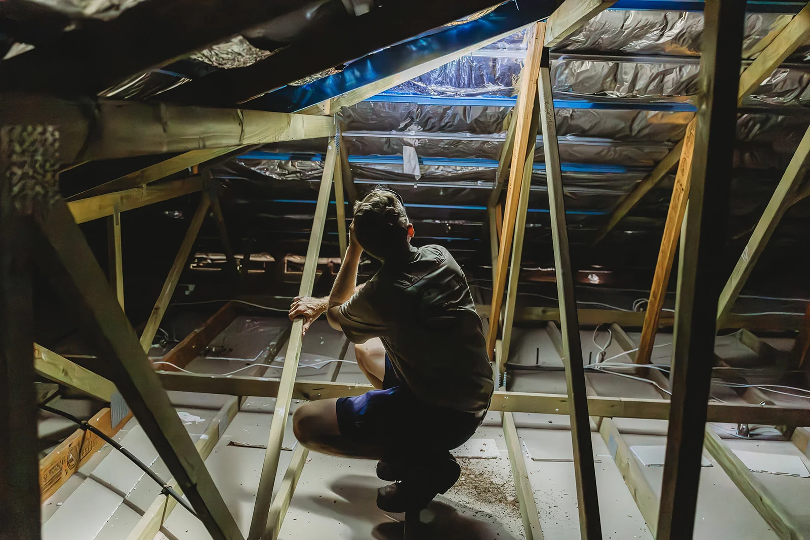 Man in attic looking around